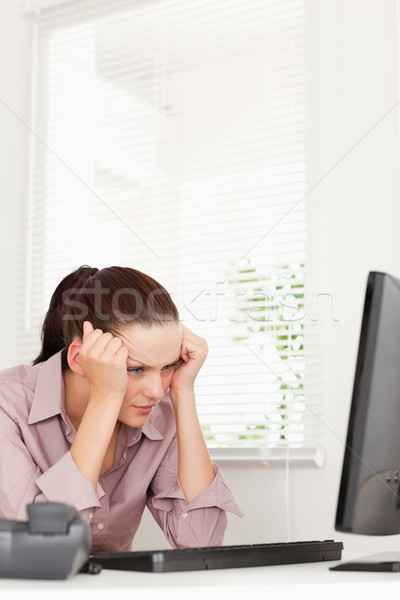 A frustrated businesswoman sitting in her office Stock photo © wavebreak_media