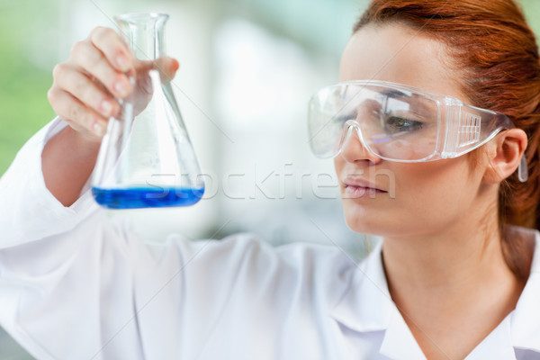 Science student looking at a liquid in a laboratory Stock photo © wavebreak_media