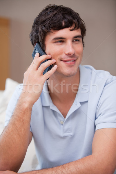Young man answering phonecall Stock photo © wavebreak_media