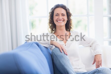 Stock photo: Attractive woman holding a book in her bedroom
