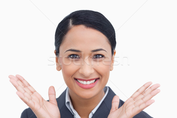 Close up of positive surprised saleswoman against a white background Stock photo © wavebreak_media