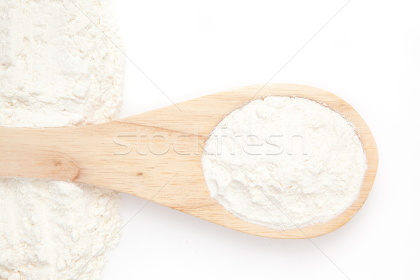 Wooden spoon with flour against a white background Stock photo © wavebreak_media