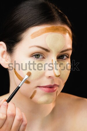 Green eyed woman wearing a headset against white background Stock photo © wavebreak_media