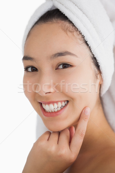 Woman wearing a towel for her hair while smiling Stock photo © wavebreak_media
