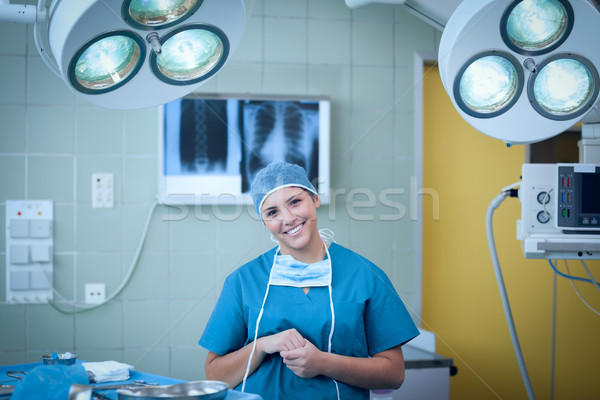 Smiling surgeon under surgical light Stock photo © wavebreak_media