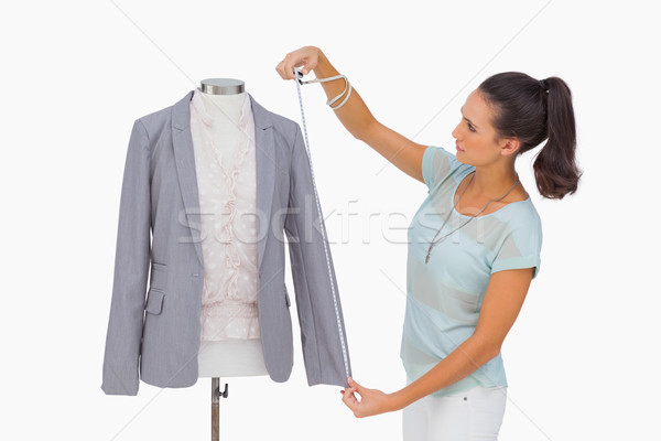 Fashion designer measuring blazer sleeve on mannequin Stock photo © wavebreak_media
