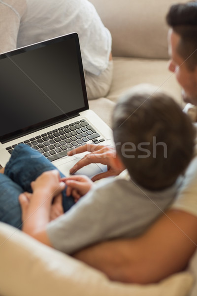 [[stock_photo]]: Père · enseignement · garçon · utilisant · un · ordinateur · portable · maison · ordinateur