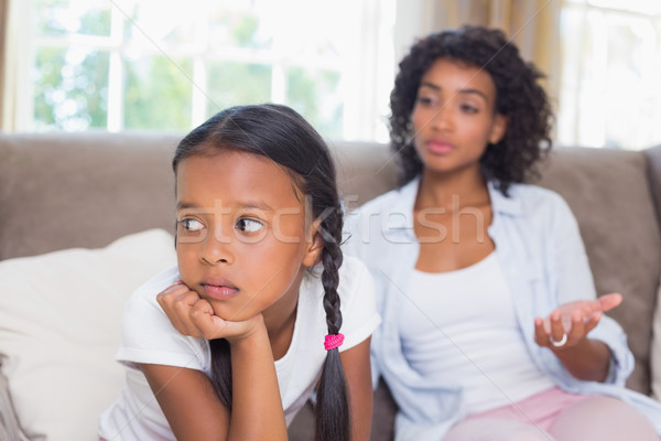 Pretty mother sitting on couch after an argument with daughter Stock photo © wavebreak_media