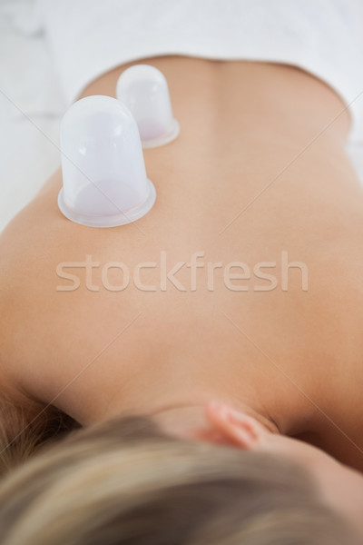 Pretty blonde with vacuum cups on her back Stock photo © wavebreak_media