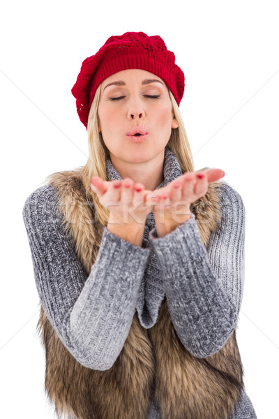 Blonde in winter clothes with hands out Stock photo © wavebreak_media