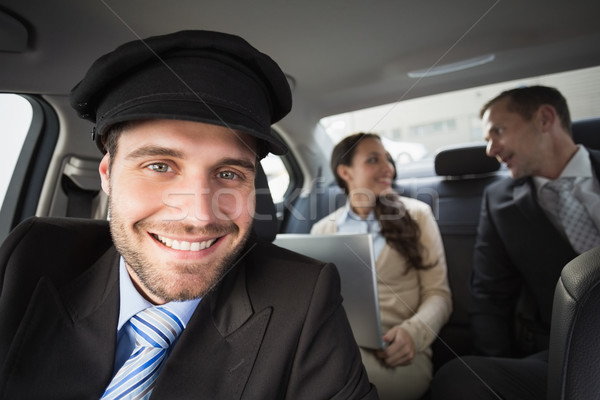élégant chauffeur souriant caméra voiture ordinateur [[stock_photo]] © wavebreak_media