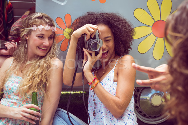 Hipster friends by camper van at festival Stock photo © wavebreak_media