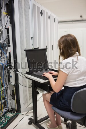 Technician sitting on swivel chair using laptop to diagnose serv Stock photo © wavebreak_media