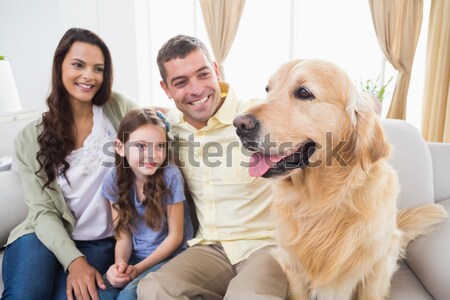 Parents and their children on sofa with labrador Stock photo © wavebreak_media