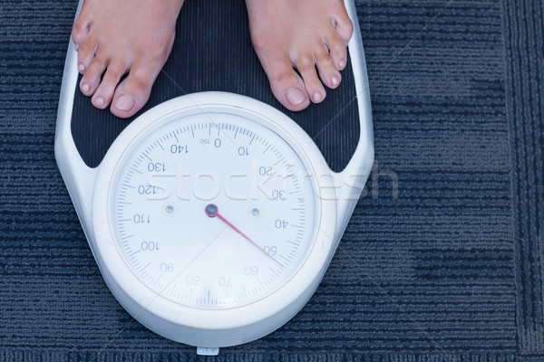 Close up of a woman standing on the scales Stock photo © wavebreak_media