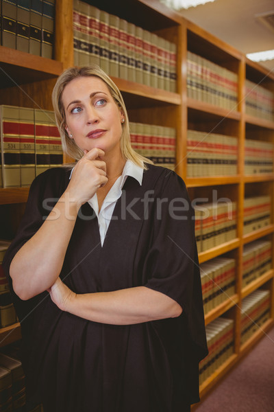 Sérieux avocat pense main menton bibliothèque [[stock_photo]] © wavebreak_media