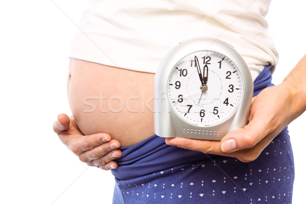 Terhes nő mutat óra dudorodás fehér egészség Stock fotó © wavebreak_media