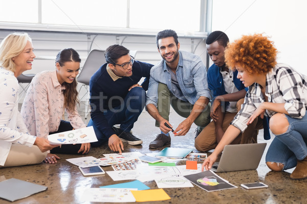 Creative business team discussing over documents Stock photo © wavebreak_media