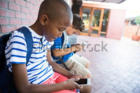 Close up of cute boy using digital laptop while sitting at table Stock photo © wavebreak_media