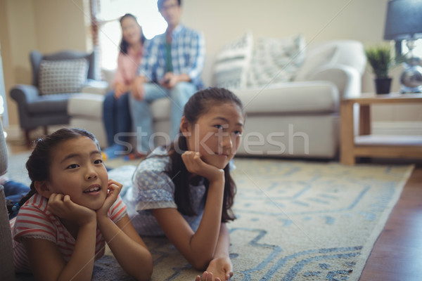 Famille ensemble salon maison télévision [[stock_photo]] © wavebreak_media