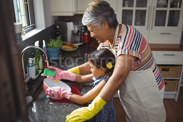 Nagymama leányunoka mosás eszköz mosogató otthon Stock fotó © wavebreak_media