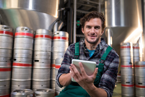 Portrait of worker using tablet computer in warehouse Stock photo © wavebreak_media