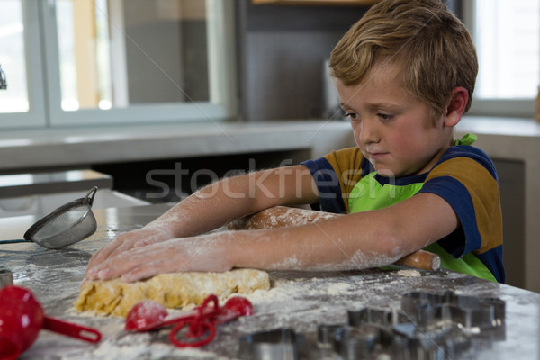 Boy baking dough in kitchen Stock photo © wavebreak_media