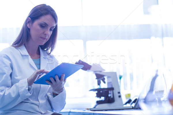 Scientist working with a tablet in laboratory Stock photo © wavebreak_media