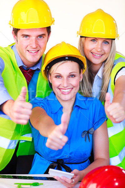 Team with hard hats looking at the camera Stock photo © wavebreak_media