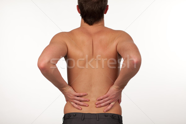 Man with backpain isolated agasint white Stock photo © wavebreak_media