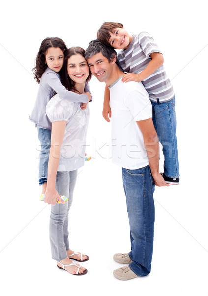 Affectionate parents giving their children a piggyback ride against a white background Stock photo © wavebreak_media