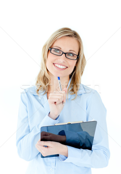 Pensive businesswoman holding a clipboard against white background Stock photo © wavebreak_media