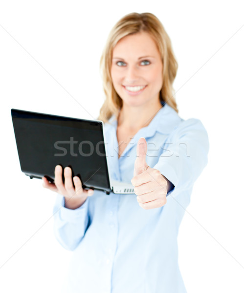 Jolly young businesswoman holding a laptop with thumb up against a white background Stock photo © wavebreak_media