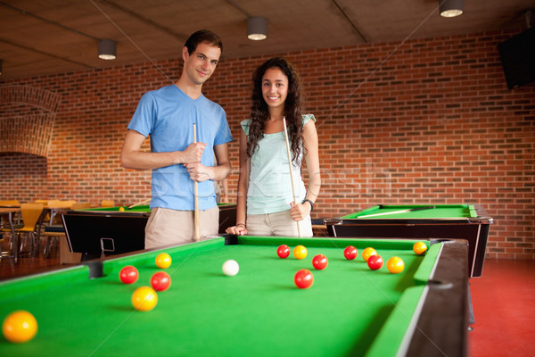 Students holding queues while standing next to a pool Stock photo © wavebreak_media