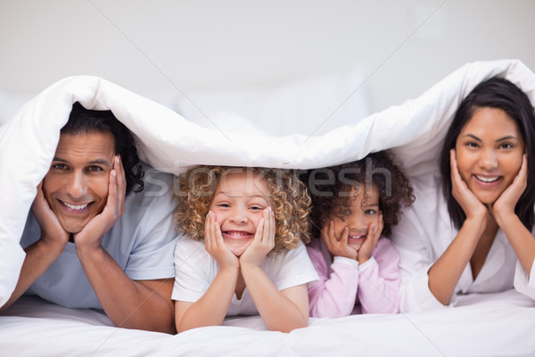 Genç aile gizleme battaniye mutlu ev Stok fotoğraf © wavebreak_media
