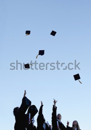 Low angle-shot of grad students throwing their hats in the sky  Stock photo © wavebreak_media