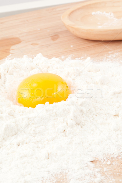 Egg yolk on the flour in a high angle view Stock photo © wavebreak_media