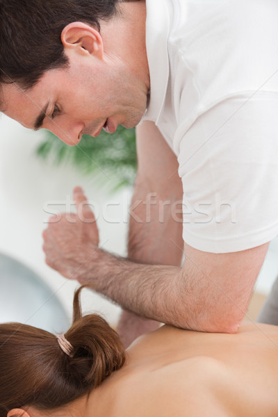 Back of woman being massaged by the elbow of doctor in a room Stock photo © wavebreak_media