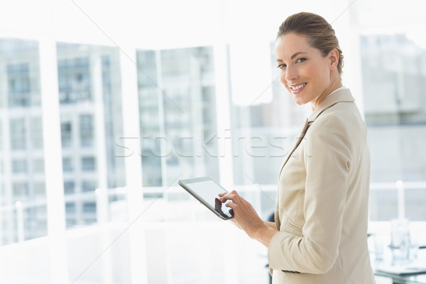 Stock photo: Beautiful businesswoman using digital tablet in office