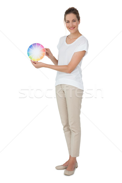 Full length of a young woman with paint samples Stock photo © wavebreak_media