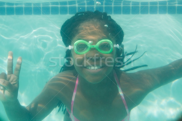 Stock photo: Cute kid posing underwater in pool