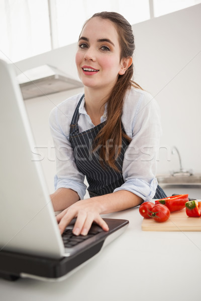 Pretty brunette following online recipe Stock photo © wavebreak_media