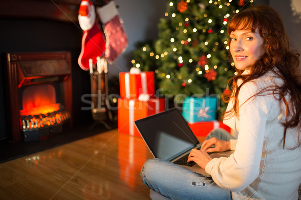 женщину сидят полу используя ноутбук Рождества Сток-фото © wavebreak_media