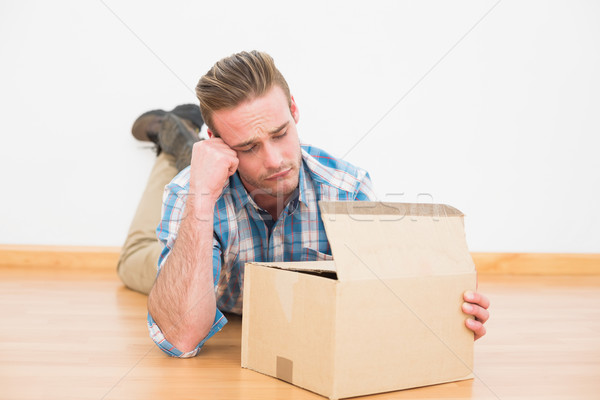 Stockfoto: Teleurgesteld · man · vloer · opening · geschenk · home