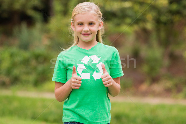 Happy little girl in green with thumbs up  Stock photo © wavebreak_media