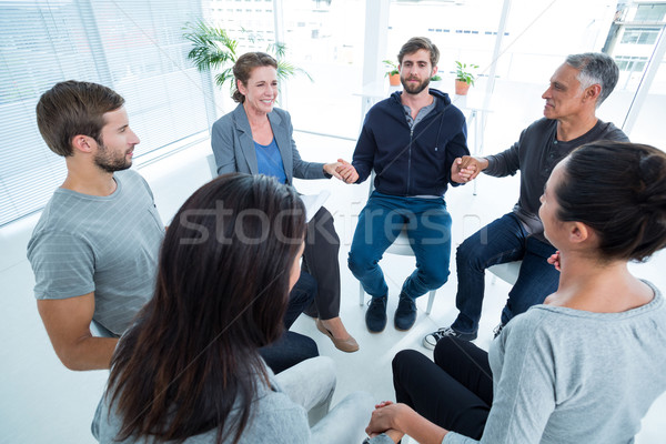 Stock photo: Group therapy in session sitting in a circle