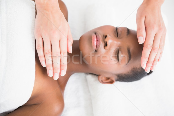 Pretty woman enjoying a reiki technique Stock photo © wavebreak_media