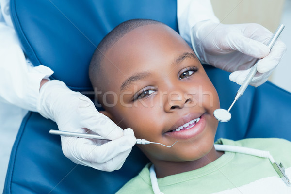 Stock photo: Close up of boy having his teeth examined