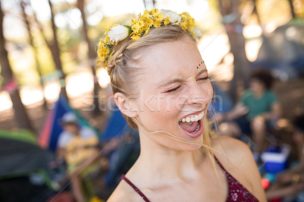 Young woman shouting with eyes closed at campsite Stock photo © wavebreak_media