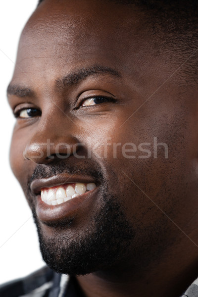 Happy man standing against white background Stock photo © wavebreak_media